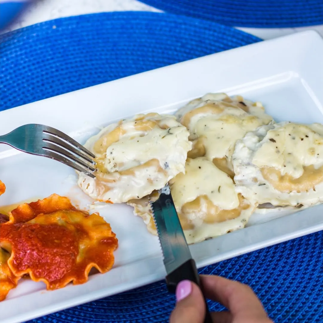 Italian ravioli served with creamy sauce
