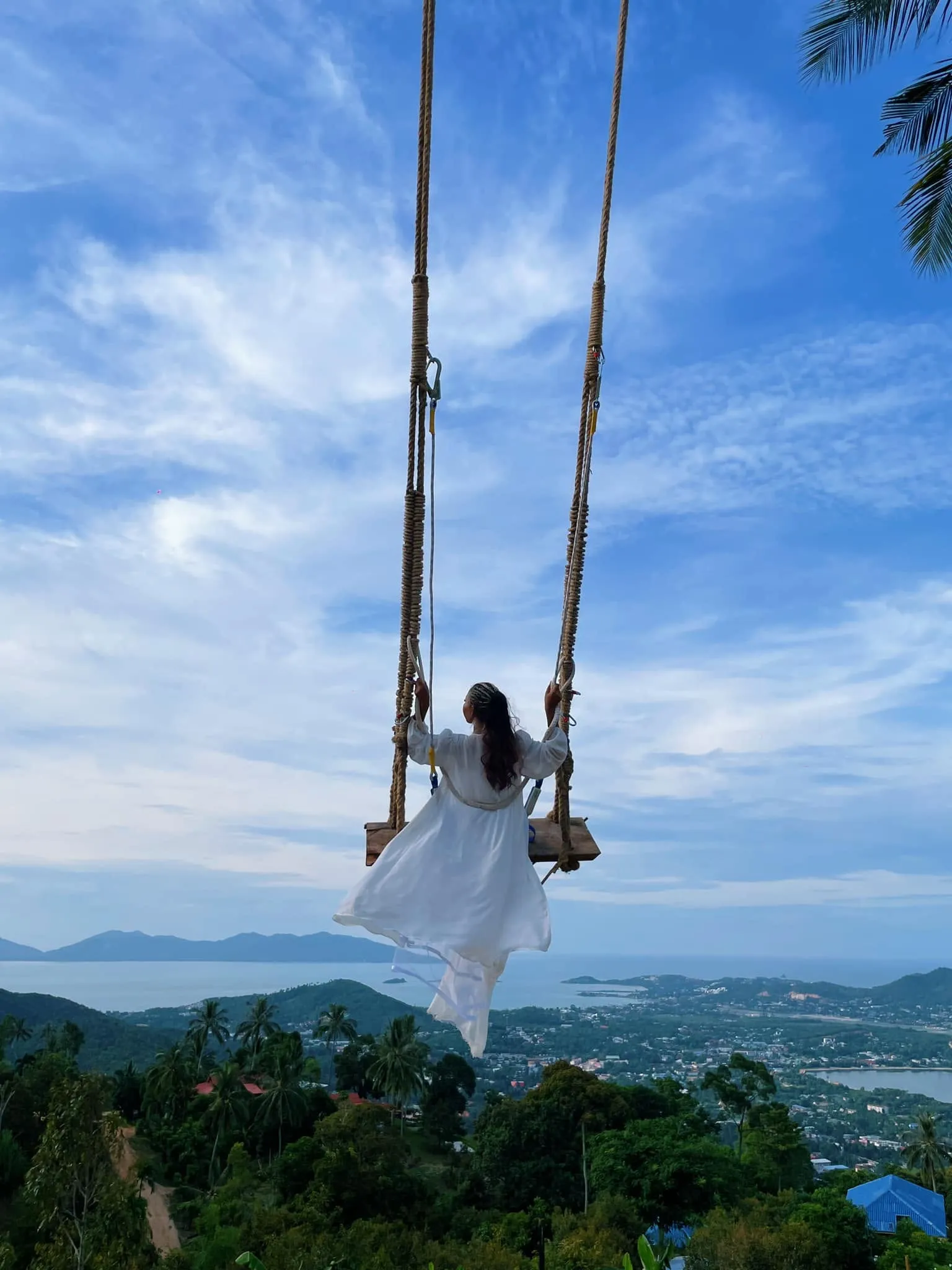 Guest riding the Highland sky swing above Koh Samui