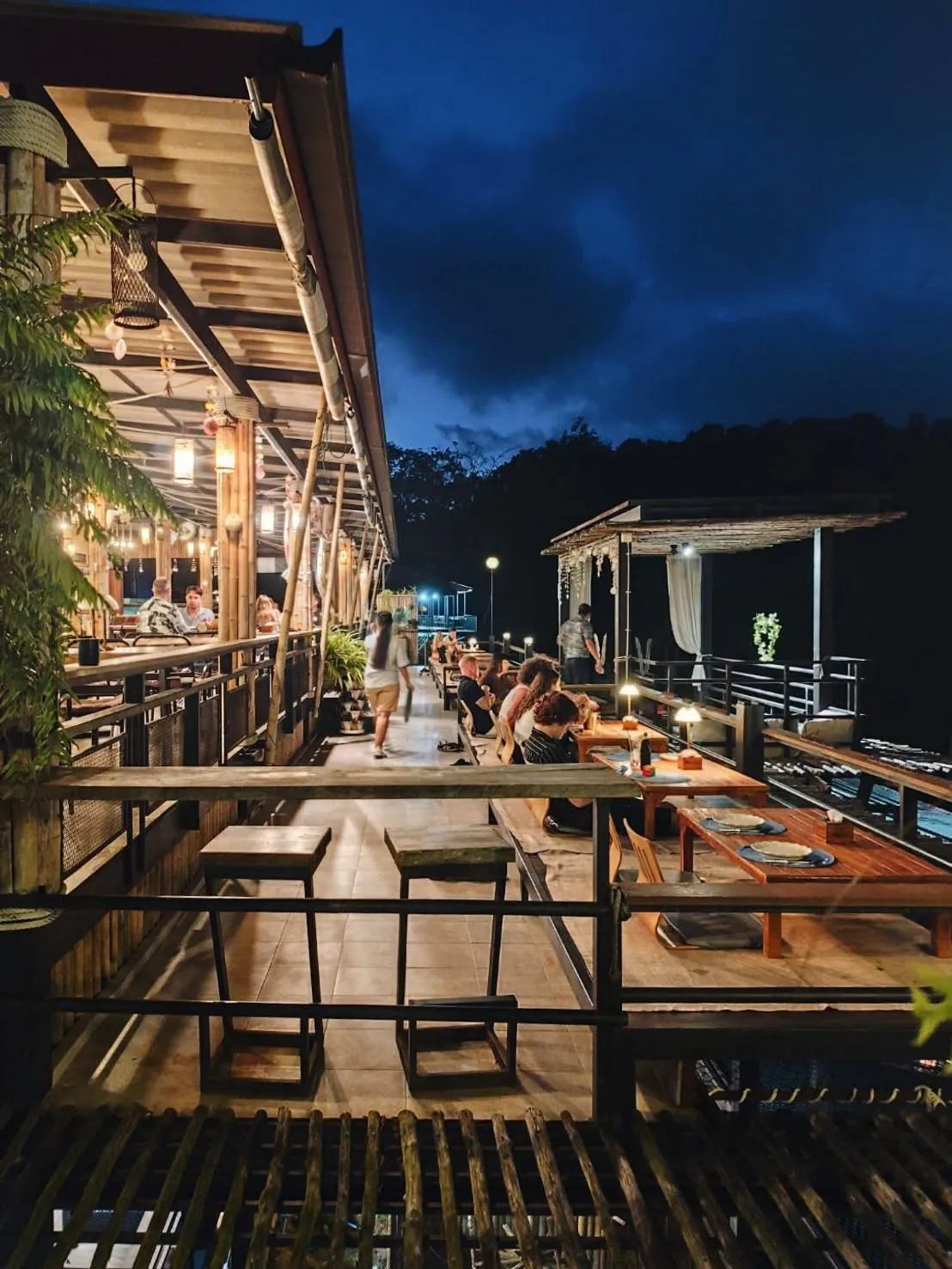 Highland Paradise terrace illuminated at night