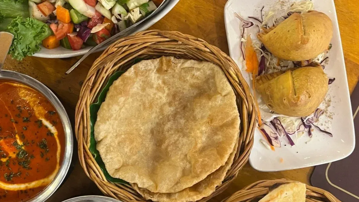 Indian meal with papadums, curry, salad and appetisers