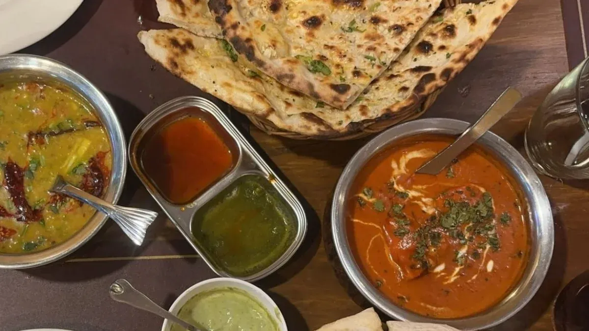 Indian curry, dal, chutneys and freshly baked naan